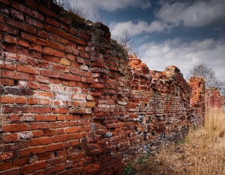 old ruined red brick wall
