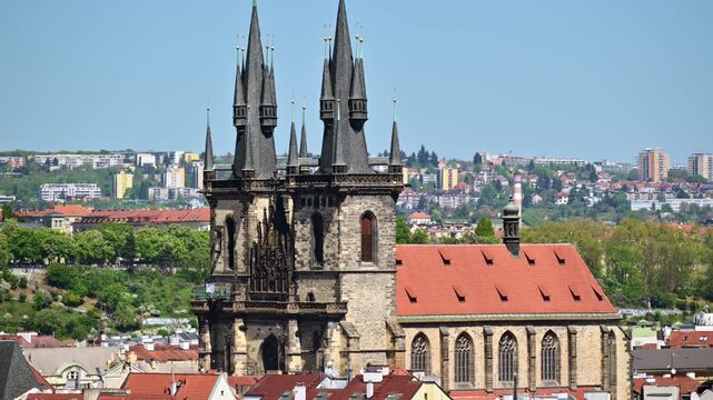 The twin Gothic spires of the Church of Our Lady before Tyn above its red tiled nave roof, Prague, Czech Republic