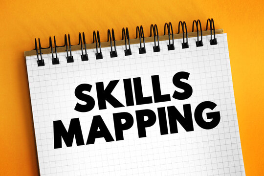 SKILLS MAPPING text written on notebook page. This office stationery supplies concept represents analyzing and organizing staff core abilities.