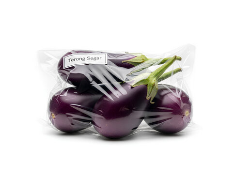 Fresh purple eggplants in plastic packaging isolated on white