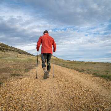 senior man is Nordic walking in foothills of Rocky Mountains in Colorado - Prairie Ridge Natural Area