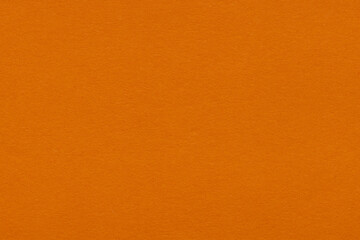 Fototapeta premium Bright Orange Paper Texture Background,Macro,Close-up macro photography of a vibrant bright orange paper surface texture with fine grain and blank space for design and background use.