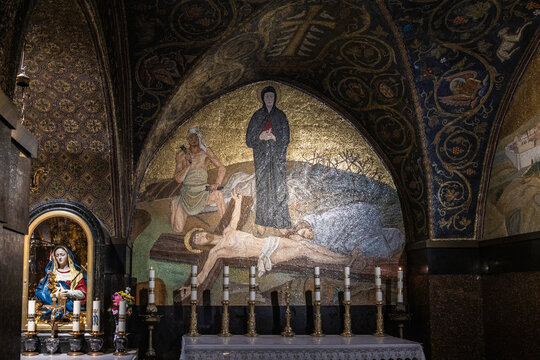 Mosaic depicting crucified Jesus on wall in Hall of Genuflection before Calvary in Church the Holy Sepulchre in Jerusalems in Israel