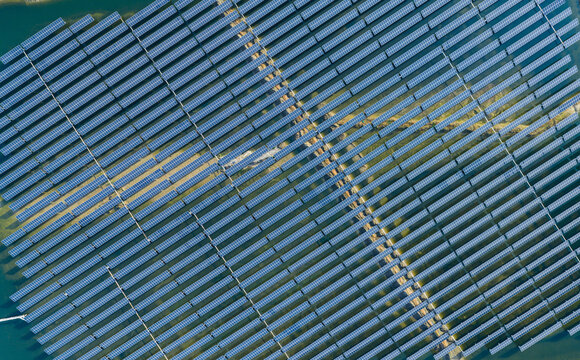  vast floating solar farm and wind turbines over water