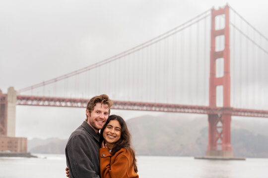 smiling couple portrait golden gate bridge san francisco 