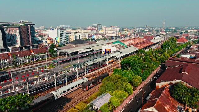 Yogyakarta railway station and tracks surrounded by dense urban buildings