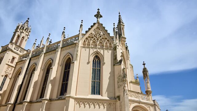 The chapel facade of Lednice Castle with tall pointed windows and clustered pinnacles, Czech Republic
