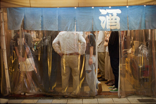 People Gather at a Small 'Standing Bar' in Osaka, Japan 