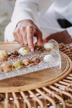 Arab man taking pralines
