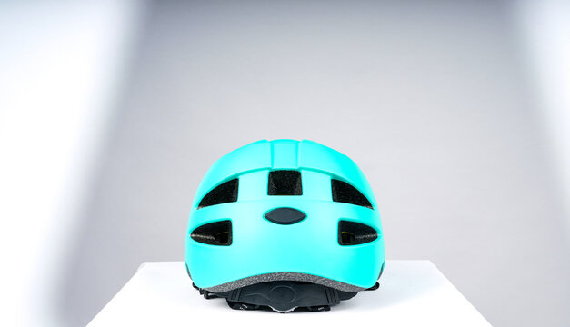 Lightweight and breathable cycling protective helmet. Product image on light gray background.