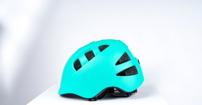 Lightweight and breathable cycling protective helmet. Product image on light gray background.