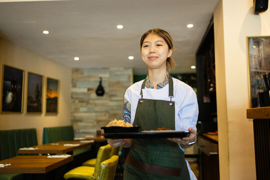 Waitress ready to serve with a smile