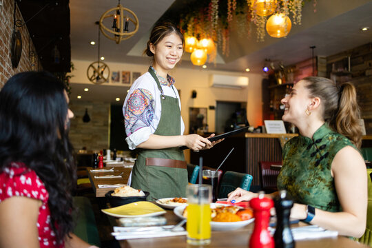 Waitress checking in with a smile