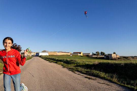 flying kite over blue sky