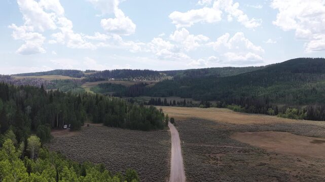 Aerial of Soapstone Pass through Uinta Wasatch Cache National Forest Utah with open grassland and dense forest