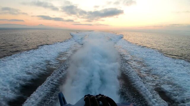 Detail of the waterjet exits of a Rodman 101 type fast boat, of the Customs Service, sailing on patrol through the bay of Alicante, Spain. 