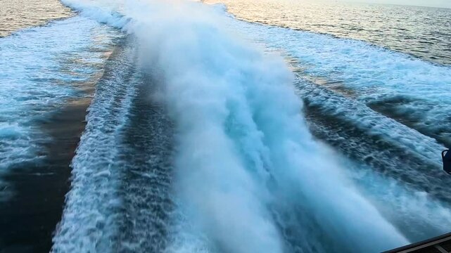 Detail of the waterjet exits of a Rodman 101 type fast boat, of the Customs Service, sailing on patrol through the bay of Alicante, Spain. 