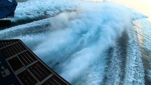 Detail of the waterjet exits of a Rodman 101 type fast boat, of the Customs Service, sailing on patrol through the bay of Alicante, Spain. 
