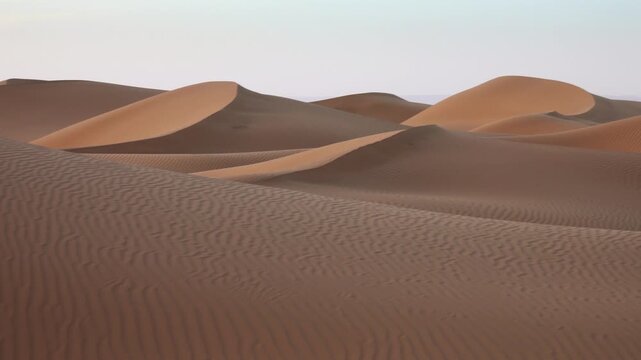 Aerial view of wind-swept sand dunes in the Sahara Desert, Morocco.