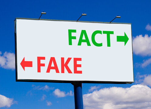 Fact or fake words symbol. Concept words Fake and Fact on beautiful white billboard. Beautiful blue sky background. Business and fact or fake concept. Copy space.