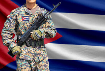 Obraz premium Cuba flag with soldier holding assault rifle