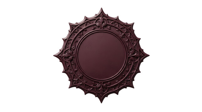 An exquisitely detailed burgundy circular frame features ornate floral and delicate leaf patterns set against a dramatic stark black background in an isolated studio setting