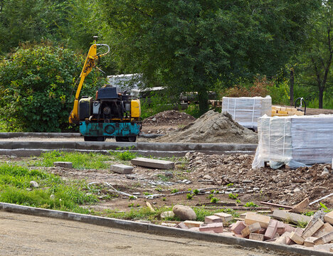A construction site where paving slabs are being laid: Abakan, Russia - August 10, 2026