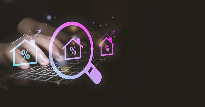 Business professional analyzing mortgage rates and real estate investment trends on digital platform, highlighting home loans, property financing, interest rates, housing market, financial planning