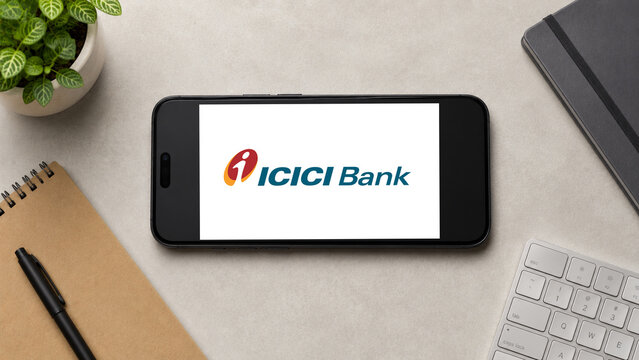 In this photo illustration, a horizontally placed smartphone displays the ICICI Bank logo on a minimalist office desk, in Guwahati, India on 13 August 2026.