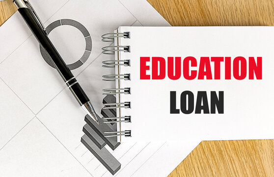Education loan concept with notebook, pen and financial charts, representing student financing, tuition costs, borrowing, credit,