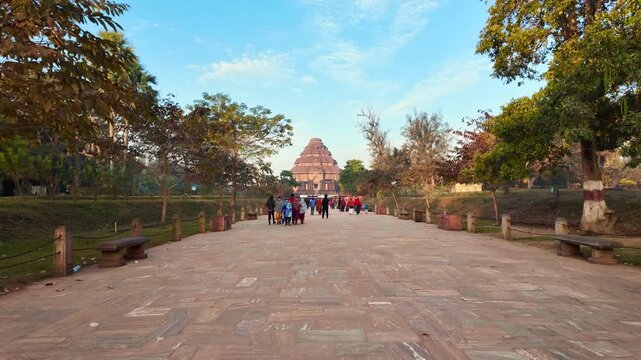 Cinematic Tilt Up Reveal Of Konark Sun Temple With Tourists On Stone Pathway