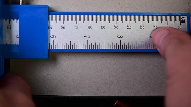 Precise mesurent copy space close up b roll video, movement measuring, construction, industry video, bokeh b roll