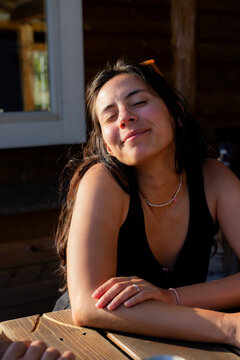 Happy woman in love sitting
