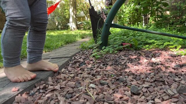 Bare feet on backyard path