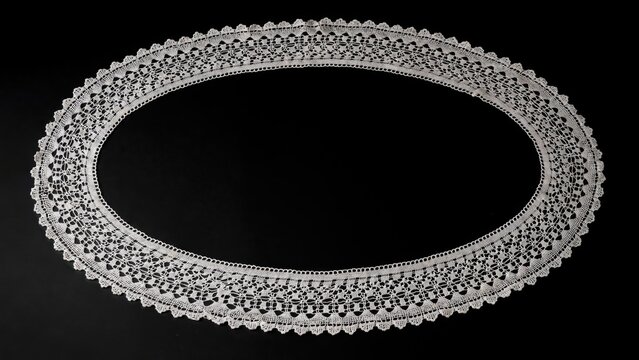 Vintage white lace collar, antique oval crochet textile border, delicate handmade embroidery on black background