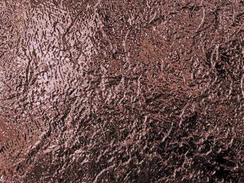 Rich rose gold abstract texture with a crinkled, metallic surface and a frosted glass effect, evoking warmth and sophistication.