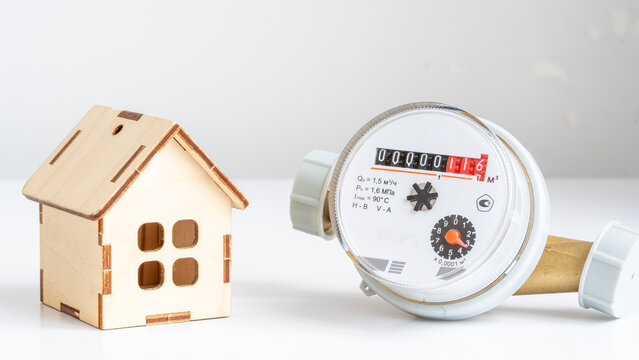 Minimalist wooden house beside water meter