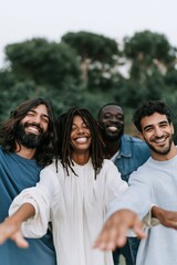 Fototapeta premium Smiling diverse friends reaching forward together outdoors for community banner and social media background showing connection and unity
