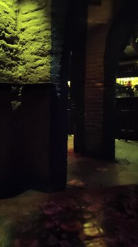Lockdown shot in slight low angle view showing an indoor night scene at empty nightclub