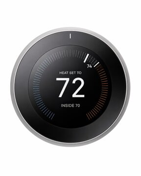 Smart thermostat displaying temperature on white background
