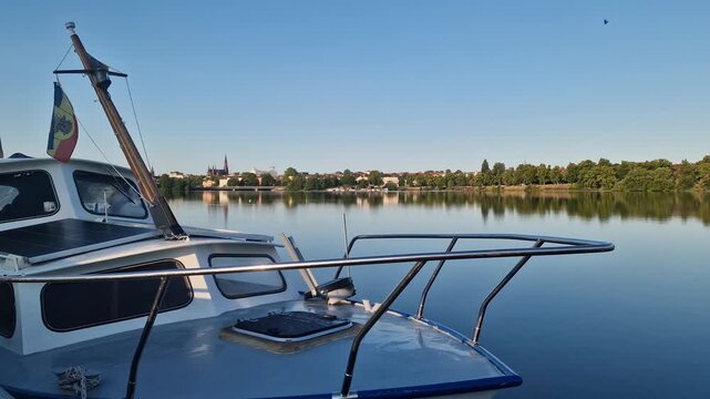 Moored motorboat on Ziegelinnensee lake in Schwerin, Germany