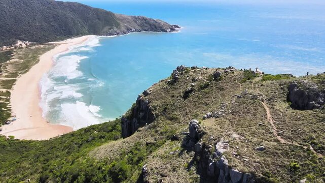 Drone Panoramic View of Morro da Coroa Mountain Ridge and Hiking Trail, Lagoinha do Leste Beach and Turquoise Ocean in Florianopolis Brazil, Wild Coastline Summit Adventure Travel Stock Video
