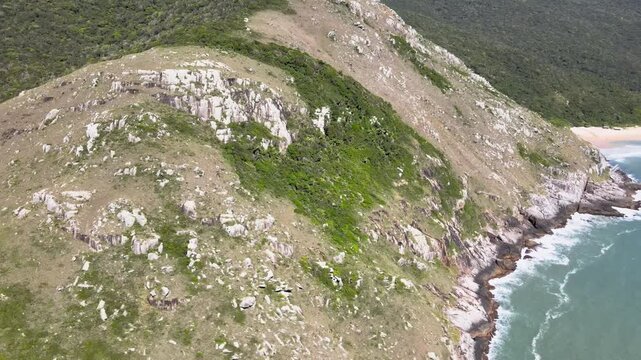 Drone View of Morro da Coroa Mountain Ridge and Sharp Rock Formations in Florianopolis Brazil, Lagoinha do Leste Beach Hiking Trail and Ocean Coastline, Adventure Wilderness Travel Footage
