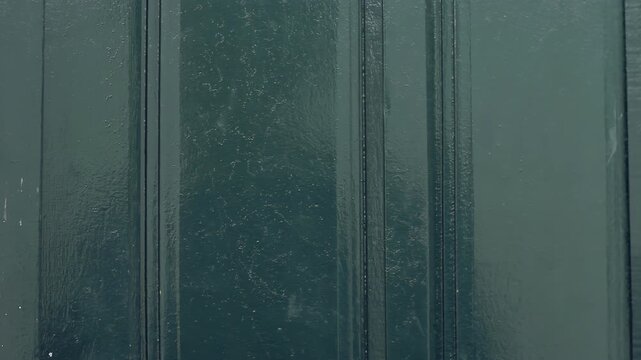 Person Knocking on Dark Green Wooden House Door Close Up - 4K