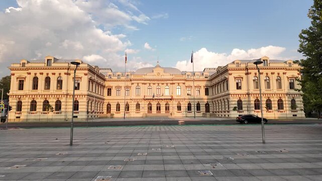 Pan of the Bacău Prefecture, also known as the Administrative Palace &mdash; a grand neoclassical government building in Romania under a dramatic evening sky.