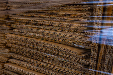 Fototapeta premium Stack of cardboard wrapped in film