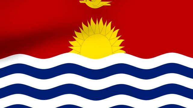 Waving national flag of Kiribati with bright red background and yellow rising sun