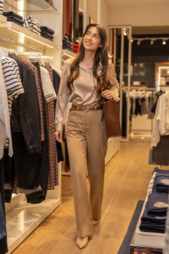 Young woman on a shopping in trendy boutique