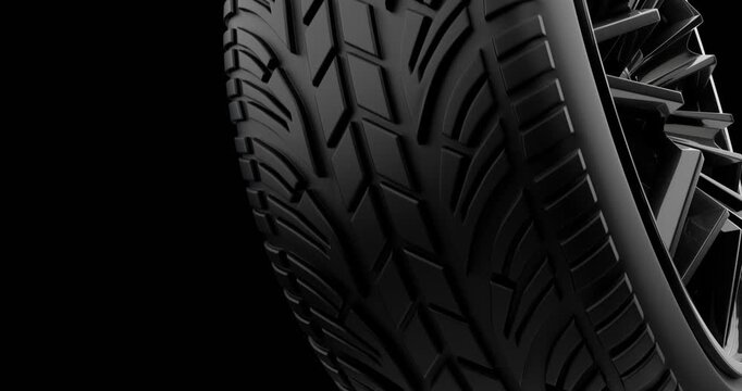 New winter tire on black background