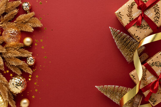 Festive Holiday Season Celebration Elements with Golden Pine Branch and Wrapped Gifts Arrangement